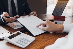 Lawyer showing clients details of a contract